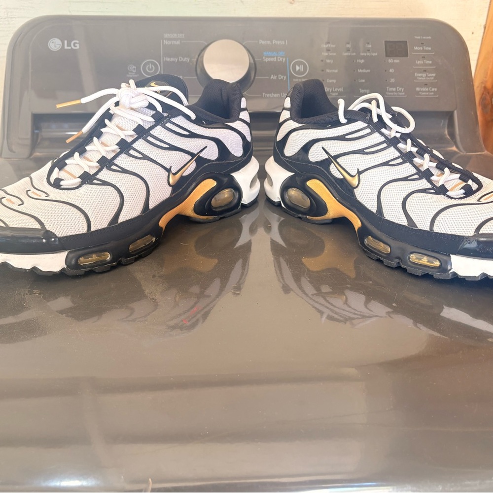Nike White and Black Sneakers with Gold Accents